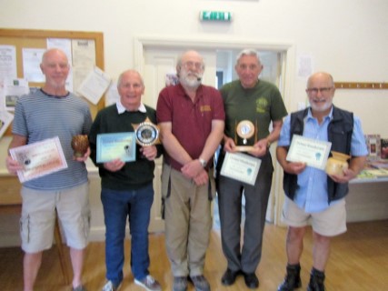 Steve Giles with the winners of the May certificates
